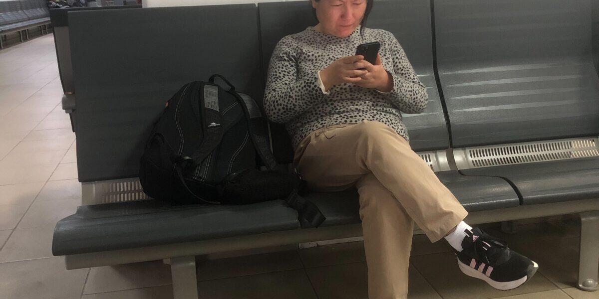 Woman checking a lead message on her smartphone quickly