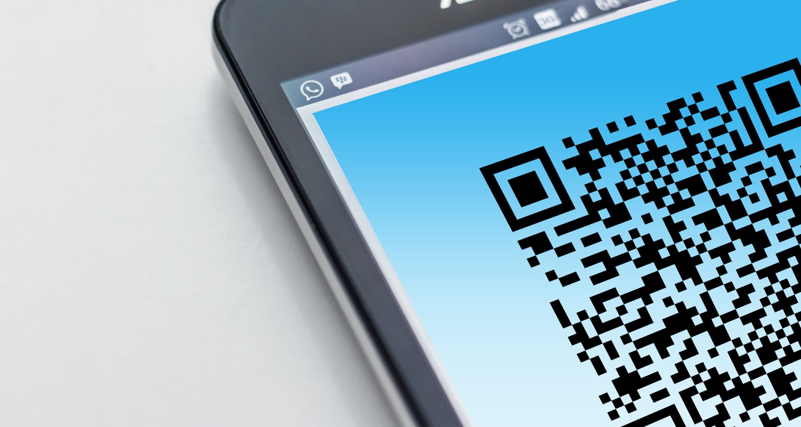 Close-up of a QR code on a smartphone screen