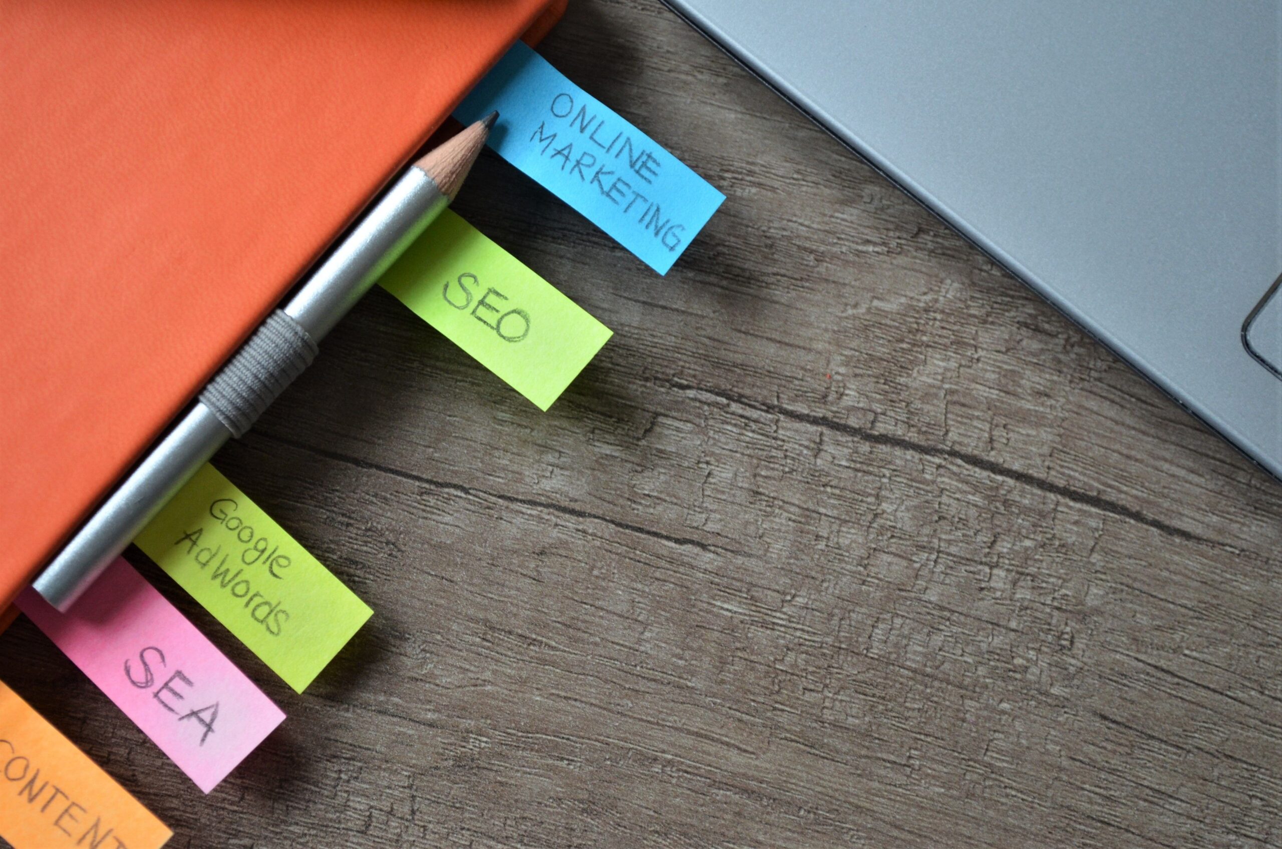 SEO and marketing strategy planning notes with sticky notes and a pencil